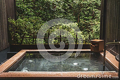 Japanese style onsen hot spring with calming nature view Stock Photo