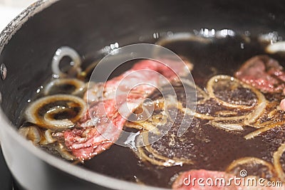 Japanese sukiyaki beef boiled in black soup iron pot Stock Photo