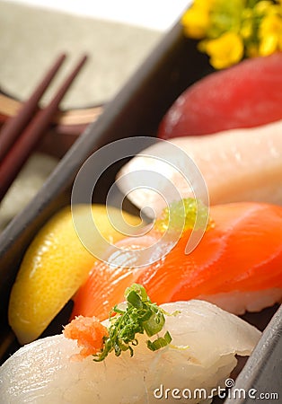 Japanese sushi nigiri with lemon and chop sticks Stock Photo