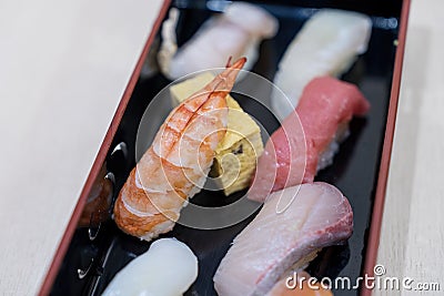 Japanese sushi set. Sushi rolls served on wood slate Stock Photo