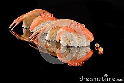 Japanese Sushi whith salmon and shrimps on black background and whith reflection. Organic food. Stock Photo