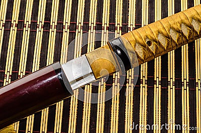 Japanese sword katana on bamboo mat Stock Photo