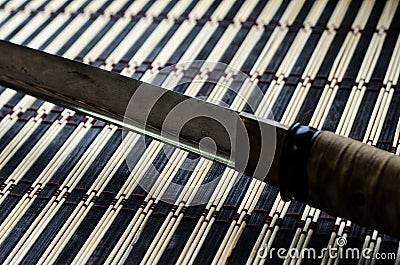 Japanese sword katana on bamboo mat Stock Photo