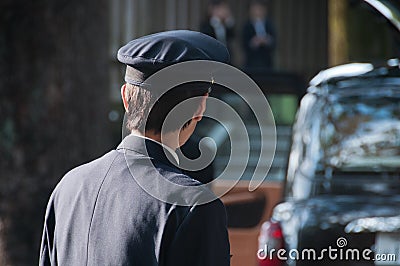 Japanese taxi driver turn left to his black taxi Editorial Stock Photo