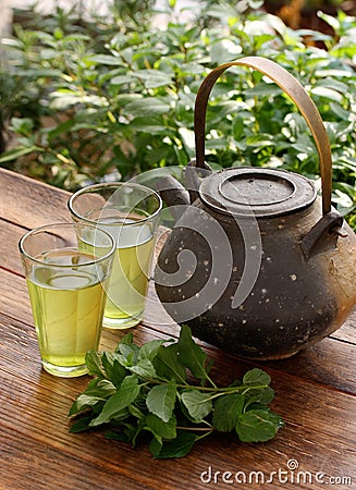Japanese teapot and green herbal tea Stock Photo