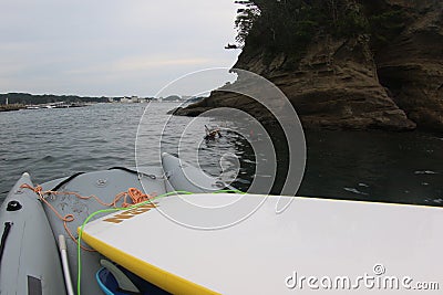 Japanese teenage boys on a dive adventure in Japan on an inflatable boat Editorial Stock Photo
