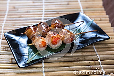 Japanese tomato Kushiyaki, Skewered and Grilled Meat Stock Photo