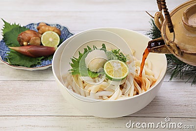 Japanese udon dishes sprinkling soup stock to noodles directly Stock Photo