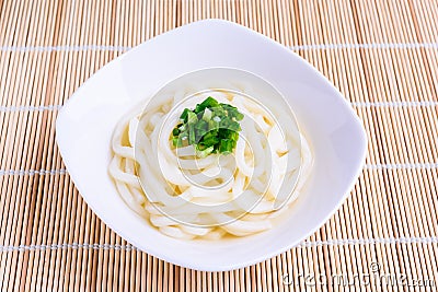 Japanese udon noodles, white bowl Stock Photo