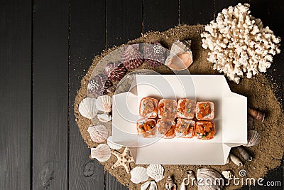 Top view of Japanese Volcano Sushi Roll with marinated salmon and green onion scallions wrapped in roasted salmon Tataki Stock Photo