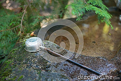 Japanese water dippers for cleaning hand before entering the temple Stock Photo