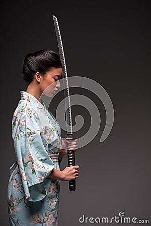 Japanese woman with katana Stock Photo