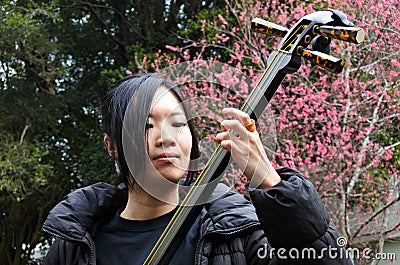 Japanese woman play on Shamisen Editorial Stock Photo