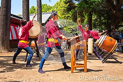 Japanese women perform Taiko drum in Bunkyo Azalea Festival Tsutsuji Matsuri at Nezu Shrine Editorial Stock Photo