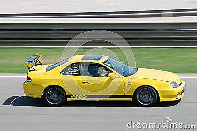 Japanese yellow Honda Prelude car skidding on a circuit Editorial Stock Photo