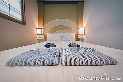 Japanese yukata and towel on bedroom in hotel, Tokyo, Japan. Vintage tone. Selective focus Stock Photo