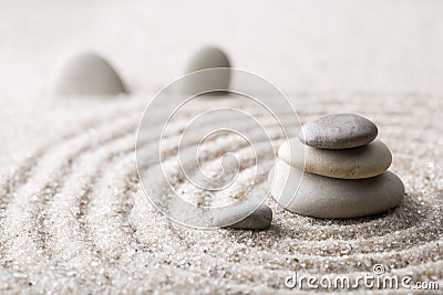 Japanese zen garden meditation stone for concentration and relaxation sand and rock for harmony and balance in pure simplicity Stock Photo