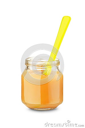 Jar of baby food with spoon Stock Photo