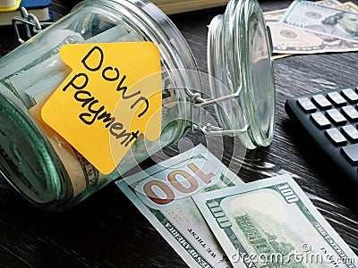 Jar and cash for mortgage with sign down payment. Stock Photo