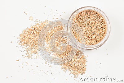 Jar with gold glossy eye shadow on white background. Isolated. Top view Stock Photo