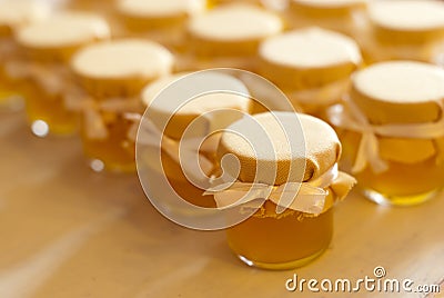 Jar of honey on white table jam Stock Photo