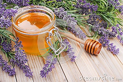 Jar of liquid honey with lavender Stock Photo
