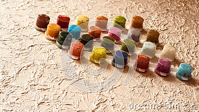 Jars With Acrylic Paint On A Light Crumpled Background Royalty-Free