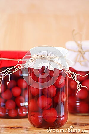 Jars with cherry compote Stock Photo