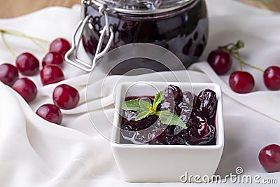 Jars with freshly homemade cherry jam, sour cherry jam, Turkish name; Visne receli Stock Photo