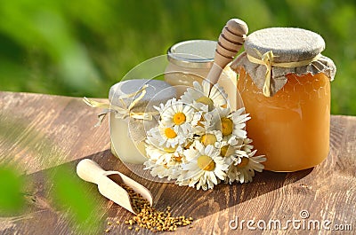 Jars full of delicious honey and bee pollen Stock Photo