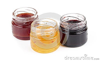 Jars full of fresh homemade colorful jams in glass Stock Photo