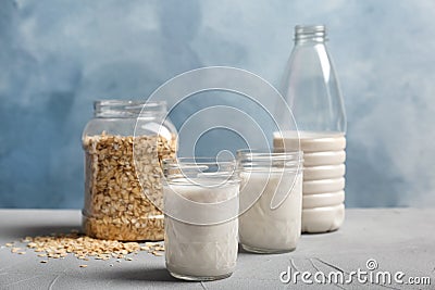 Jars with oat milk and flakes Stock Photo