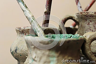 Jars of paints and tassels for potter Stock Photo