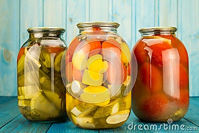 Jars of pickled vegetables. Marinated food. Stock Photo