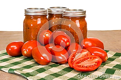 Jars of tomato sauce with paste tomatoes Stock Photo