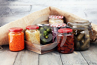 Jars with variety of pickled vegetables. Preserved food. Stock Photo