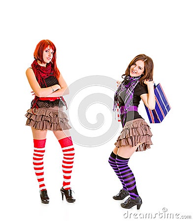 Jaunty girl with shopping bags and her girlfriend Stock Photo