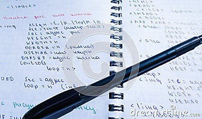 Translations of calculus systems on a notebook and black pen. creation of computer programs. work of the programmer and system Stock Photo