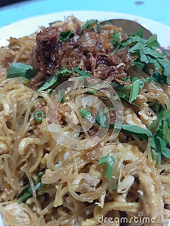 Javanese fried noodles with a sprinkling of delicious celery fried onions when eaten warm Stock Photo