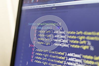 Javascript and HTML front-end source code. Laptop screen layout of web developer Editorial Stock Photo