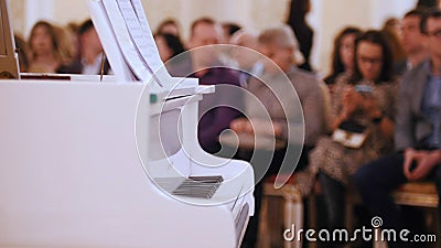 A jazz concert in the concert hall. Piano and audience on a background Stock Photo