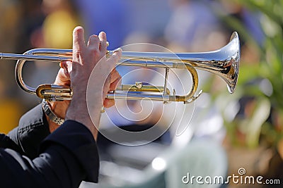 Jazz musician plays his shining trumpet Stock Photo