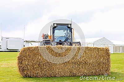 Jcb teleskid with bale of straw hay Editorial Stock Photo