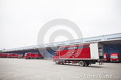 JD.com trucks receiving incoming goods and preparing shipments at the Northeast China based Gu'an warehouse and distribution Editorial Stock Photo