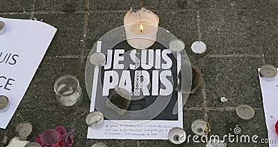 Je Suis Paris sign. STRASBOURG, FRANCE - NOV 16, 2015: Je suis Paris - messages, candles and flowers are left around General Kleber statue in memorial for the Je Suis Paris sign. STRASBOURG, FRANCE - NOV 16, 2015: Je suis Paris - messages, candles and flowers are left around General Kleber statue in memorial for the
