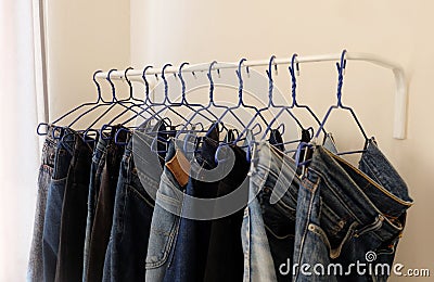 Jeans hanging, drying cloth, men Stock Photo