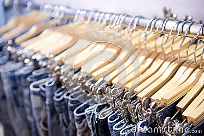 Jeans hanging on rack Stock Photo