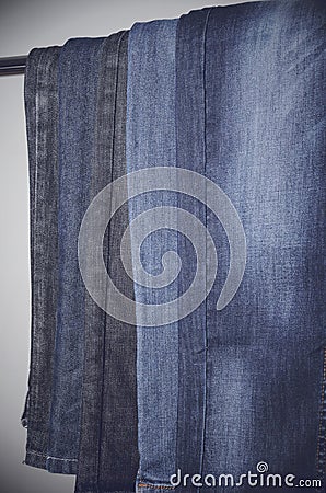 Jeans hanging vertically on a hanger. vertical Stock Photo