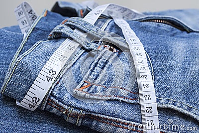 Jeans and measuring tape Stock Photo