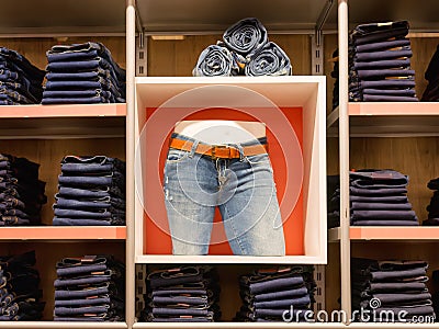 Jeans shop scene with shelves and mannequin Stock Photo